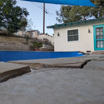 Complete Pool Services - Side view of improper elevation of flagstones - Pool Cleaners Near Me - Ontario, California