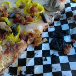 Legends Bar - Large, burnt pieces on the bottom of my pizza.