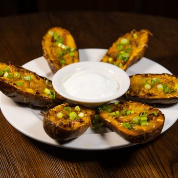 Cattlemen's Steakhouse - a plate of baked potatoes with a dip - Steakhouses Near Me - Willow Springs, Missouri Cattlemen's Steakhouse - a plate of baked potatoes with a dip - Steakhouses Near Me - Willow Springs, Missouri