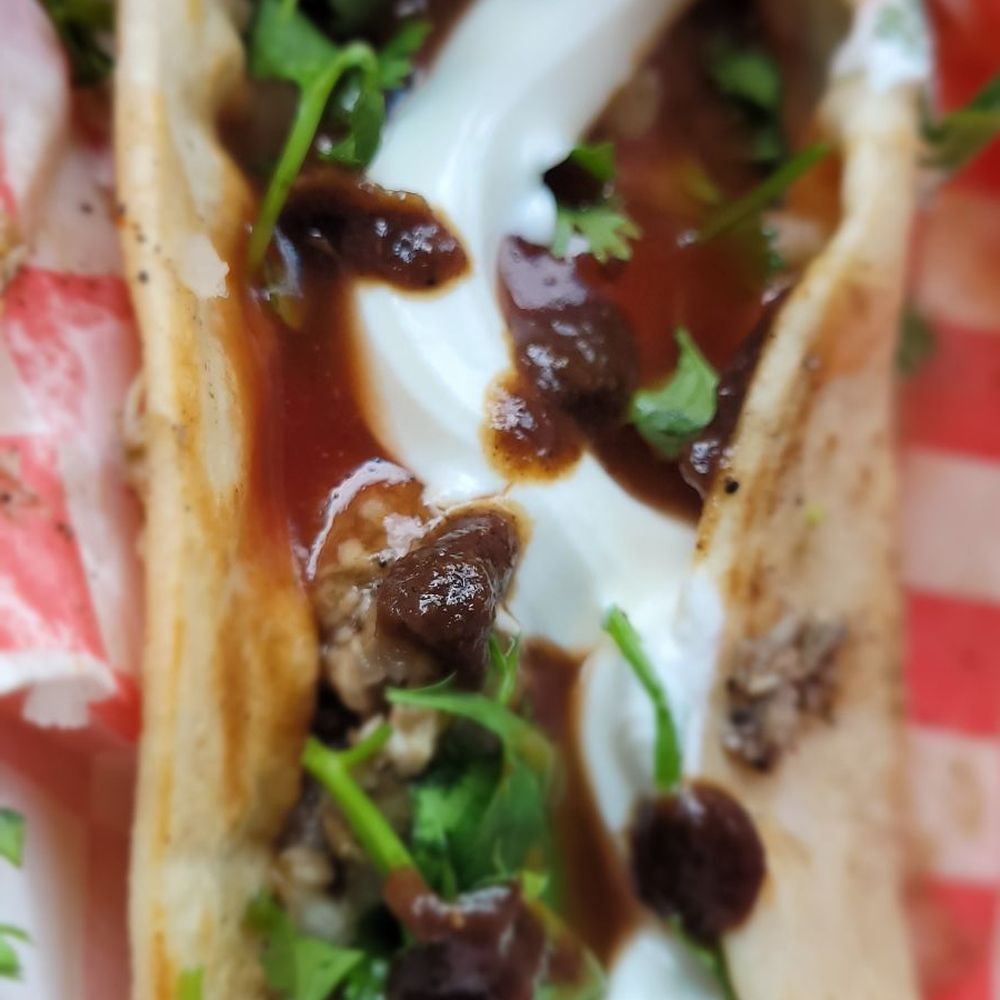Munches Good Eats - Jerk tacos are make from the same seasoned Jerked chicken as the Rolls served with Jerk sauce and sour cream and cheese. - Food Trucks Near Me - Houston, Texas Munches Good Eats - Jerk tacos are make from the same seasoned Jerked chicken as the Rolls served with Jerk sauce and sour cream and cheese. - Food Trucks Near Me - Houston, Texas
