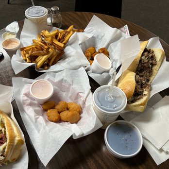 The Philadelphian - a table full of food - Sandwiches Near Me - Sandy, Utah The Philadelphian - a table full of food - Sandwiches Near Me - Sandy, Utah