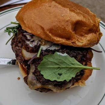 Holy Grale - Holy burger of the week(week of 3/11/19) with smoked onion jam, Swiss cheese, fritje sauce and southern mixed greens on brioche. - Beer Gardens Near Me - Louisville, Kentucky Holy Grale - Holy burger of the week(week of 3/11/19) with smoked onion jam, Swiss cheese, fritje sauce and southern mixed greens on brioche. - Beer Gardens Near Me - Louisville, Kentucky