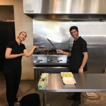 Chortke - The owners in front of their amazing gas-charcoal grill for meat and tomatoes - Persian/Iranian Near Me - Rochester, New York Chortke - The owners in front of their amazing gas-charcoal grill for meat and tomatoes - Persian/Iranian Near Me - Rochester, New York