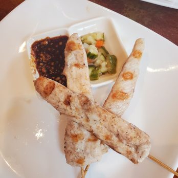 Pandan Room - skewers on a plate with dipping sauce - Thai Near Me - Hackettstown, New Jersey Pandan Room - skewers on a plate with dipping sauce - Thai Near Me - Hackettstown, New Jersey