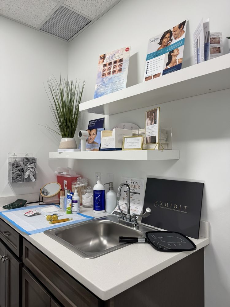 Exhibit Medical Aesthetics Logo