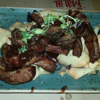 La Malinche - Costilla de ibérico deshuesada con salsa a la barbacoa. - Signature Cuisine Near Me - Santander, S