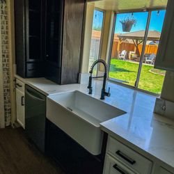 Custom Kitchen Counters - Upgraded farmhouse sink installed, custom cabinets installed, quartz counter tops installed.