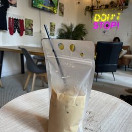 Coquito Latte TO GO! With whiskey infused coffee--so good!  Love the to go "cup".