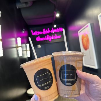 Barvida - a person holding two cups of coffee - Juice Bars & Smoothies Near Me - New Canaan, Connecticut