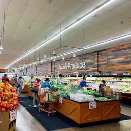customers shopping in the produce section customers shopping in the produce section
