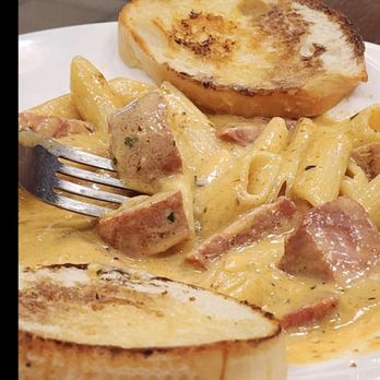 The District Bar & Grill - Creamy Cajun Pasta with homemade Andouille Sausage. - Bars Near Me - Harrisonville, Missouri