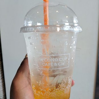 Second Cup - a person holding a drink in their hand - Cafes Near Me - Montreal, Quebec