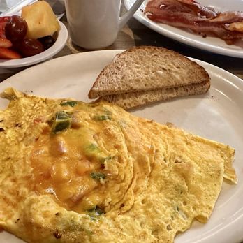 Westtown Restaurant - Fiesta Omelette with Fruit Bowl and an extra side of Crispy bacon - American Near Me - Winston Salem, North Carolina Westtown Restaurant - Fiesta Omelette with Fruit Bowl and an extra side of Crispy bacon - American Near Me - Winston Salem, North Carolina