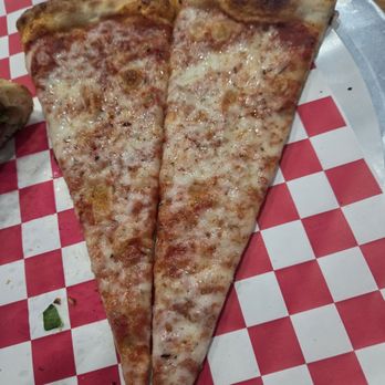That Pizza Joint - Cheese pizza slice (cut in half as we were sharing) - Pizza Near Me - Coconut Creek, Florida That Pizza Joint - Cheese pizza slice (cut in half as we were sharing) - Pizza Near Me - Coconut Creek, Florida