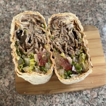 Shaurma Factory - 2 inches thick. I wish the vegetables & wrap were more evenly rolled, but still delicious - Fast Food Near Me - New York, New York