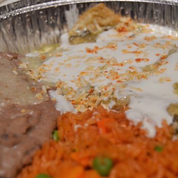 Lucha Libre - Green chicken enchilada plate with rice and beans - Mexican Near Me - San Diego, California
