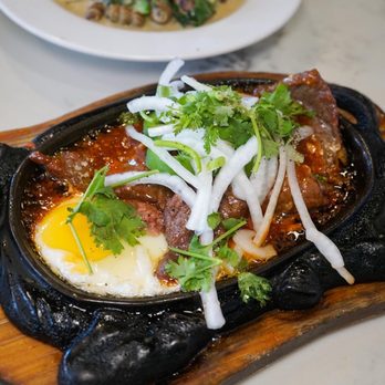 Saigon Chicken House - a plate of food on a table - Vietnamese Near Me - Boston, Massachusetts