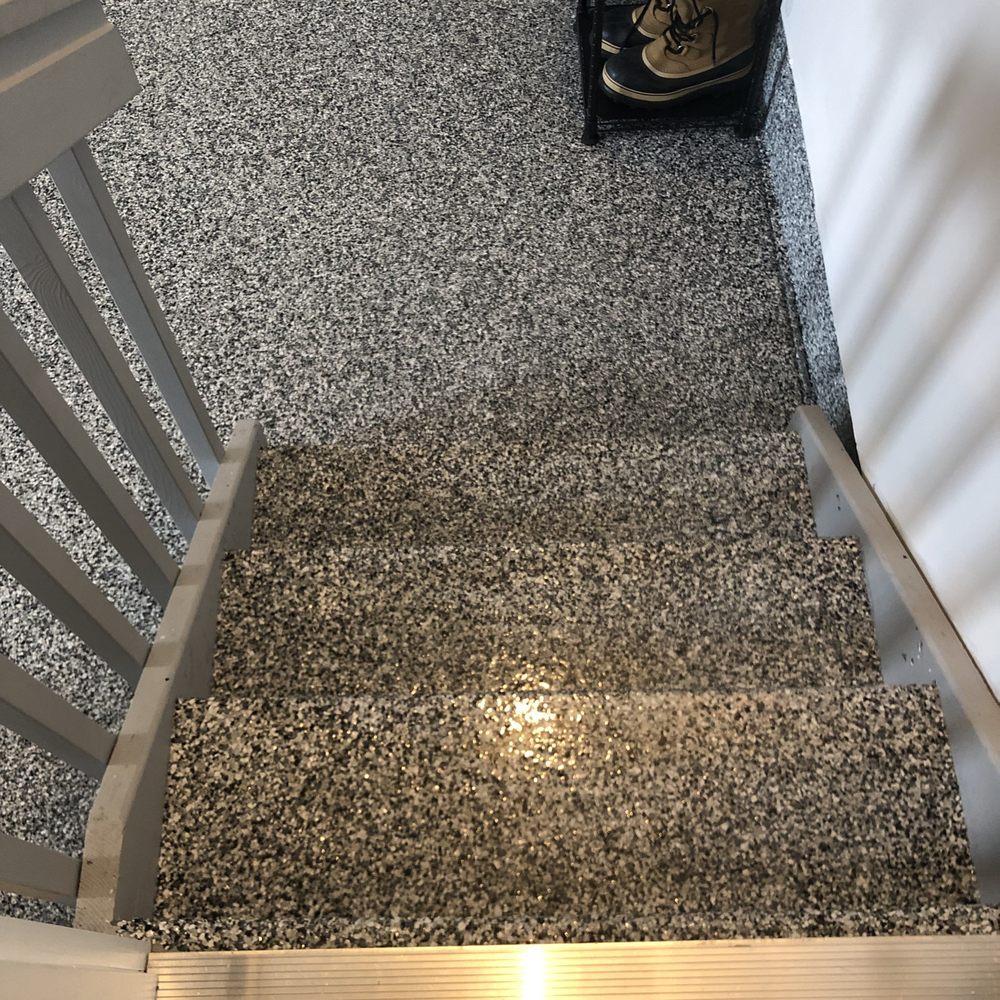 a view of the stairs leading up to the garage