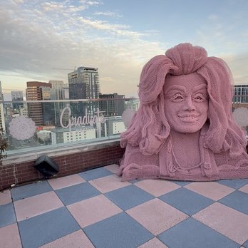 White Limozeen - Outdoor patio with great city view and Dolly Parton inspired sculpture - Cocktail Bars Near Me - Nashville, Tennessee