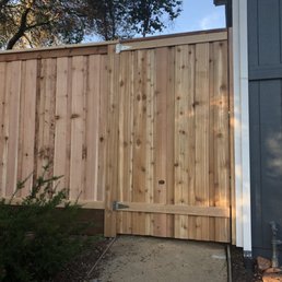 Gate and 7' (overall height) board-on-board cedar fence with steel posts, top cap, and kick board. Gate and 7' (overall height) board-on-board cedar fence with steel posts, top cap, and kick board.