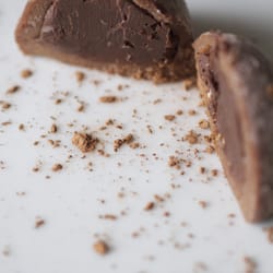 Waialua Dark Chocolate Truffle Mochi, split in two (cocoa poweder added for effect) =)