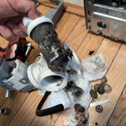 W88 Appliance Repair - Washer drain filter clogged with debris and coins--cleaned out to restore smooth water flow and prevent future issues.