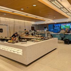 Delta Sky Club - Self-serve food buffet and bar at Delta Sky Club at Miami International Airport, South Terminal, located next to Concourse H security.