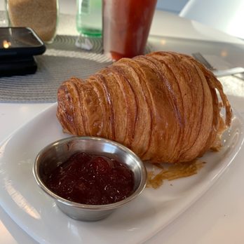 The Yellow Cup - Croissant and ice americano - Coffee & Tea Near Me - Houston, Texas The Yellow Cup - Croissant and ice americano - Coffee & Tea Near Me - Houston, Texas