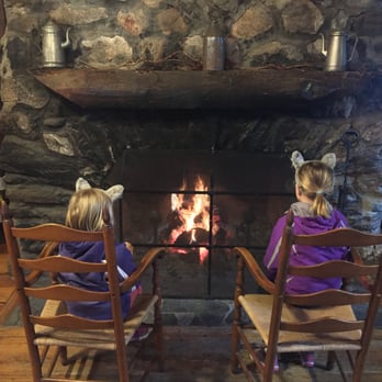 The 1761 Old Mill - Girls in front of the fire in the main entry way. - American Near Me - Westminster, Massachusetts
