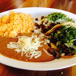 El Rodeo Mexican Grill and Seafood - Lunch special-2 tacos, rice, beans for $6.59...free chips and salsa always...the tacos are loaded