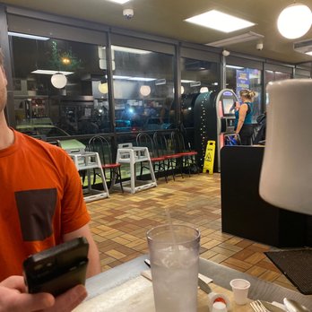Waffle House - a man sitting at a table with a phone - Diners Near Me - Port Charlotte, Florida Waffle House - a man sitting at a table with a phone - Diners Near Me - Port Charlotte, Florida