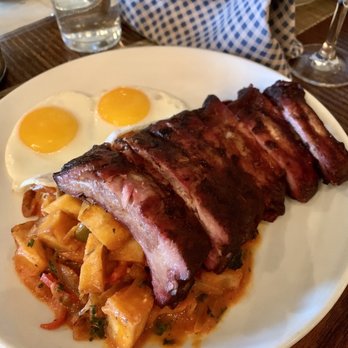 Rye Leawood - Smoked baby back ribs on top of potato hash with sunny side eggs - New American Near Me - Leawood, Kansas