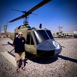 Naval Air Station Fallon - My high school friend that works at Top Gun in front of a Huey... I was a passenger a lot in them when I was an US Army LT
