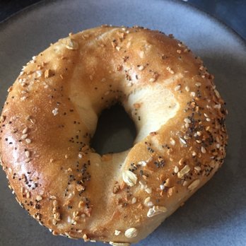What A Bagel Cafe - My everything bagel missing much of the topping - Bagels Near Me - White Plains, New York