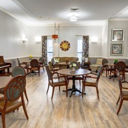 Ridgmar Place - Ridgmar Place | Independent Living | Fort Worth, TX | Tables and seating around a piano
