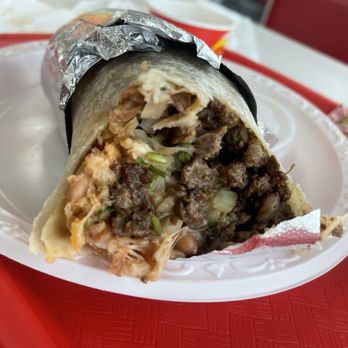 Tacos Gavilan - Carne asada burrito with cheese, cilantro, onions, and red salsa inside. - Mexican Near Me - Huntington Park, California Tacos Gavilan - Carne asada burrito with cheese, cilantro, onions, and red salsa inside. - Mexican Near Me - Huntington Park, California