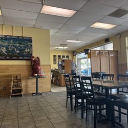Rolling Wok - Dining area in back corner facing entrance.