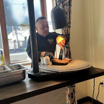 Gastro Social - Fr Leo working the brisket carving station. - Italian Near Me - Baltimore, Maryland