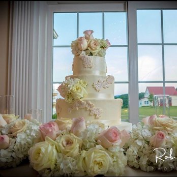 Sweet & Savory Bake Shop - a wedding cake surrounded by flowers - Bakeries Near Me - Frederick, Maryland Sweet & Savory Bake Shop - a wedding cake surrounded by flowers - Bakeries Near Me - Frederick, Maryland