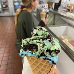 Oreo mint and Cookie Monster flavors in a waffle cone Oreo mint and Cookie Monster flavors in a waffle cone