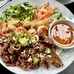 Grilled pork and shrimp vermicelli combo with egg roll.