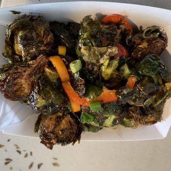 Corndoggies - brussels sprouts and peppers in a paper container - Food Trucks Near Me - Fort Collins, Colorado