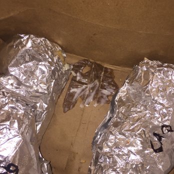 Chipotle Mexican Grill - Sour cream on bottom of bag, leaking from poorly wrapped burrito. - Mexican Near Me - Syracuse, New York Chipotle Mexican Grill - Sour cream on bottom of bag, leaking from poorly wrapped burrito. - Mexican Near Me - Syracuse, New York