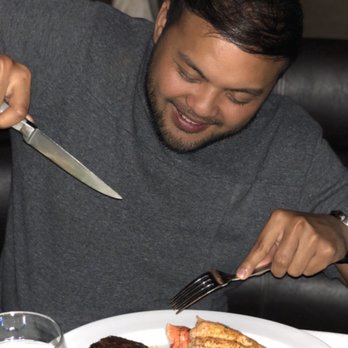 Ocean Prime - Mickey digging in to his surf and turf - Seafood Near Me - Chicago, Illinois Ocean Prime - Mickey digging in to his surf and turf - Seafood Near Me - Chicago, Illinois