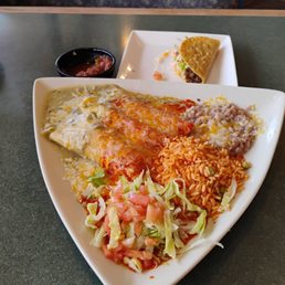 3 rolled ground beef enchiladas, Christmas, refried beans, rice and garnish. Forgot to order onions. Next time. I needed to also try a taco. 3 rolled ground beef enchiladas, Christmas, refried beans, rice and garnish. Forgot to order onions. Next time. I needed to also try a taco.