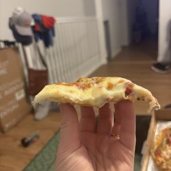 Uncle Leo's Pizza - Half inch stack of mozzarella cheese