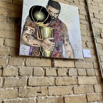 Insomnia Restaurant & Lounge - a painting of a man holding a trophy - Lounges Near Me - Toronto, Ontario Insomnia Restaurant & Lounge - a painting of a man holding a trophy - Lounges Near Me - Toronto, Ontario