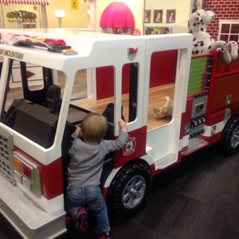 Discovery Playtown - Climbable fire truck - Preschools Near Me - Maple Valley, Washington