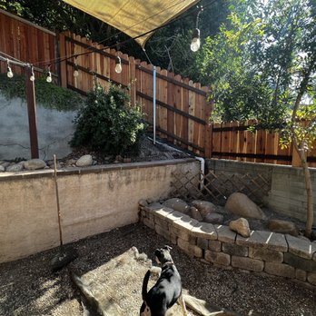 Modesto Ayala Fence - New redwood fence with metal posts installed on hillside and on top of existing retaining wall. Also new metal post to attach shade sail to. - Fences & Gates Near Me - San Diego, California Modesto Ayala Fence - New redwood fence with metal posts installed on hillside and on top of existing retaining wall. Also new metal post to attach shade sail to. - Fences & Gates Near Me - San Diego, California