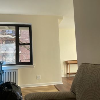 Renaissance Renovations - a living room with a view of the city - General Contractors Near Me Renaissance Renovations - a living room with a view of the city - General Contractors Near Me